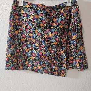 Wild Fable brand colorful floral asymmetrical wrap mini skirt with a tie closure